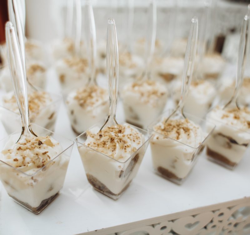 Desserts in the portion molds stand on the catering table